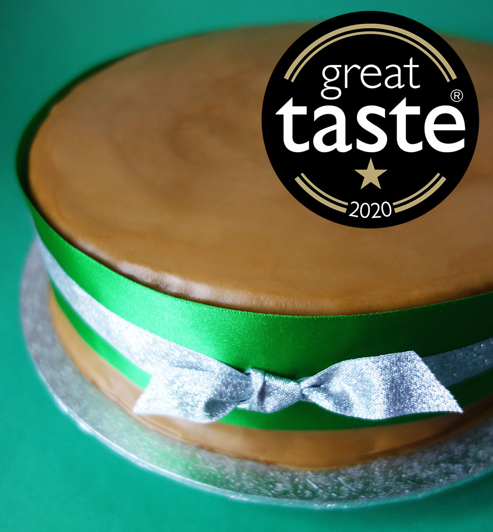 A Great Taste Award winner. Rich, rummy Luxury Christmas Cake, made with organic fruit steamed in Appleton Jamaica Rum and Amontillado sherry. Sweetened with organic blackstrap molasses, no added sugar. Covered with organic Lübecker marzipan and dark rum frosting. All ingredients gluten free. Can be posted to addresses in the UK and abroad. Delivery by hand in London