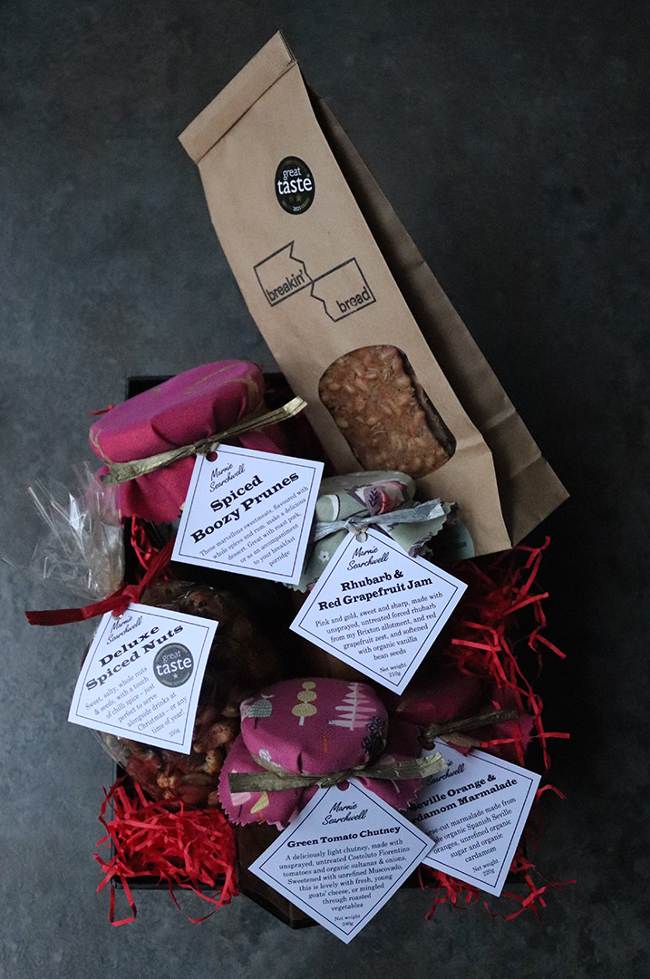 Christmas Hamper: Spiced Boozy Prunes, Breakin' Bread crispbread, Deluxe Spiced Nuts, and jars of Rhubarb & Red Grapefruit Jam, Green Tomato Chutney and Seville Orange & Cardamom Marmalade