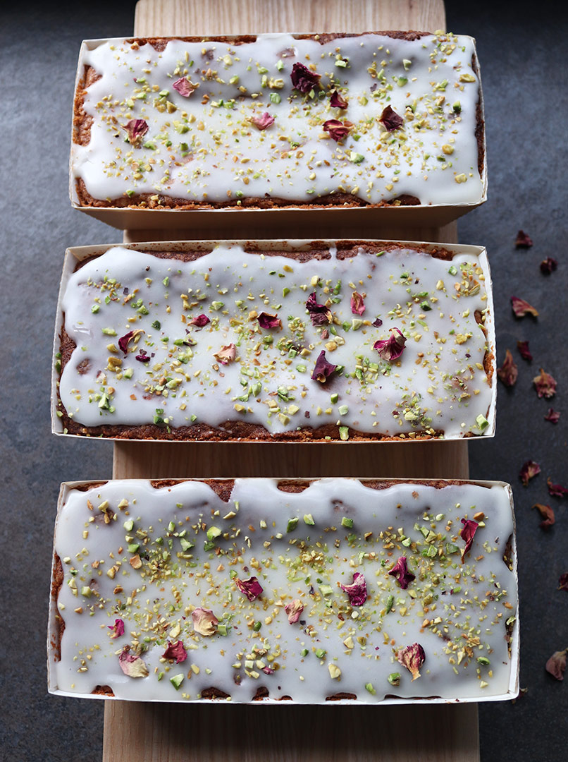 Moist, aromatic Lemon and Pistachio loaf cakes. Made with gluten free, wheat free ingredients. Decorated here with nibbed pistachios and rose petals. Delivery or collection in London, can be posted. All ingredients organic and glutenfree