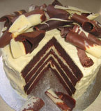 Push the boat out with this decadent, four-layer chocolate cake, made with organic dark Fairtrade chocolate and dark muscovado sugar. All ingredients gluten free. Filled and frosted with an organic white chocolate and sour cream combo, and topped with organic milk, dark and white chocolate curls. Delivery in London