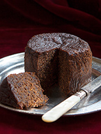 Awarded gold at the Great Taste Awards, this dark, moist, silky-smooth, intensely alcoholic Jamaican fruitcake (gluten-free, dairy-free) is made with organic fruit, finely chopped then soaked in Appleton Jamaica Rum. Sweetened with organic blackstrap molasses, no added sugar. All ingredients gluten free, diary free. No nuts included, but not guaranteed free from nut traces. This delicious fruit cake keeps well and matures with age: perfect for sharing with friends and family. Can be posted to addresses in the UK and abroad and delivered by hand in London