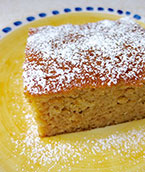 Gluten free, dairy free Honey & Orange Cake, made with organic ground almonds, rapeseed oil and whole oranges. Perfect if you're cutting down on sugar, this is delicately sweetened with agave syrup and honey. Shown dusted with unrefined icing sugar (optional). All ingredients gluten-free and dairy-free