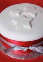 This beautiful glutenfree Christmas Cake can be posted to UK addresses and abroad and delivered by hand in London. Moist and dark, it is made with organic fruit and toasted almonds steamed in Appleton Jamaia rum. Sweetened with organic blackstrap molasses, no added sugar. Covered with marzipan and soft white icing. Gluten free. This luxury fruitcake is the perfect Christmas gift, or to share with friends and family 