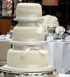 3 tier wedding cake made with gluten free and wheat free organic ingredients. Topped with marzipan and smooth ivory icing