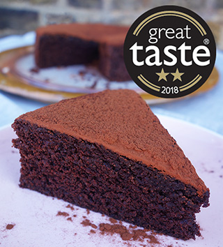 Awarded 2 stars at the 2018 Great Taste Awards, this gluten-free and dairy-free chocolate cake is deliciously fudgy. Made with organic gluten free, dairy free ingredients