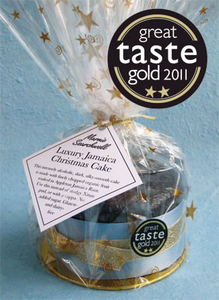 Awarded gold at the Great Taste Awards 2011, this dark, moist, silky-smooth, intensely alcoholic Jamaican Christmas Cake is made with organic vine and citrus fruit, finely chopped then soaked in Appleton Jamaica Rum and sherry. Sweetened with organic blackstrap molasses, no added sugar. This dark, rich fruit cake makes a lovely alternative to Christmas pudding. Gluten free, diary free. No nuts included, but not guaranteed free from nut traces. This delicious Christmas Cake keeps well and matures with age: the perfect Christmas gift or for sharing with friends and family. Can be posted to addresses in the UK and abroad. Delivery by hand in London