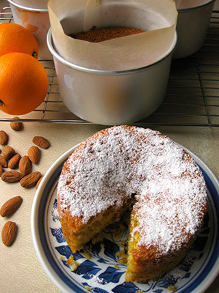 Award-winning Tunisian Orange & Almond Cake, made with gluten free and dairy free ingredients: organic ground almonds, oranges and extra-virgin olive oil. Comes with a sachet of organic icing sugar to dust before serving. This cake won a Great Taste award in 2013. All ingredients gluten-free and dairy-free. Can be posted in the UK, or delivered by hand in London