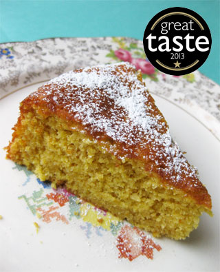 Award-winning glutenfree, dairyfree Tunisian Orange & Almond Cake. Made with organic ground almonds, oranges and extra-virgin olive oil. Comes with a sachet of organic icing sugar to dust before serving. This cake won a Great Taste award in 2013. All ingredients gluten-free and dairy-free. Can be posted in the UK, or delivered by hand in London