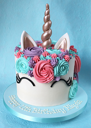 Gluten free Unicorn Cake: layers of glutenfree chocolate sponge, filled and frosted with goats butter vanilla buttercream, with sugarpaste horn and ears. Delivery in London