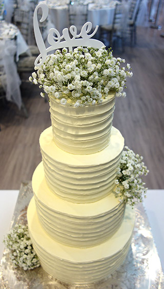 4-tier gluten-free Chocolate wedding cake. Two tiers of organic, gluten free White Chocolate Cake, and two tiers of Great Taste award-winning Reine de Saba, made with Appleton Jamaica Rum, glutenfree. All wedding cakes made with glutenfree, organic ingredients. Filled and frosted with Swiss meringue buttercream. Wedding service includes delivery and assembly at your London venue