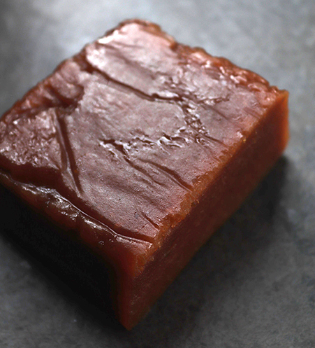 A firm, fruity block of Quince Cheese: Made with ripe allotment quinces and unrefined organic cane sugar. A fabulous, fragrant addition to your cheeseboard