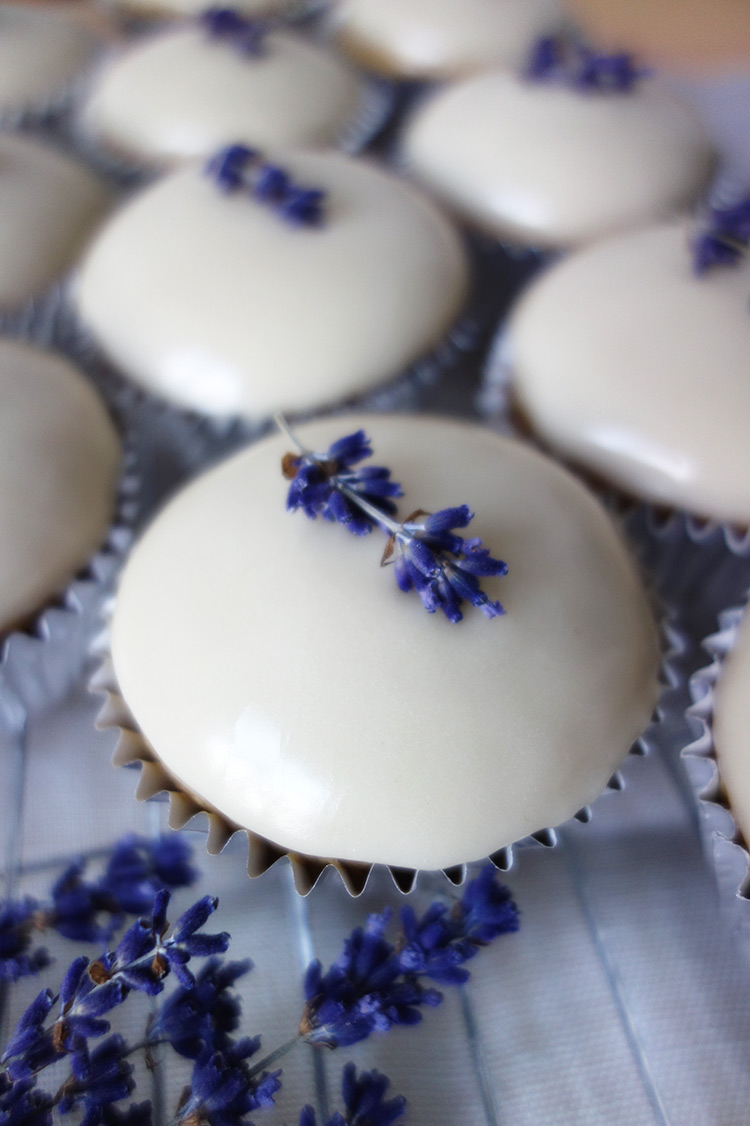 Gluten free, vegan Lavender cupcakes, made with organic ingredients. Topped with fondant icing and lavender sprigs