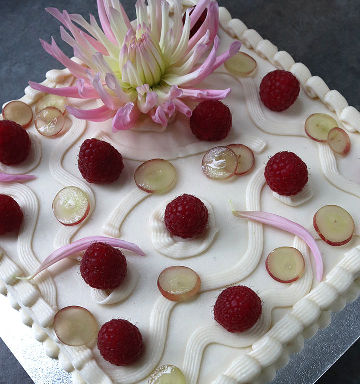 Gluten free celebration cakes – all shapes and flavours. This one is a vegan carrotcake, filled & frosted with vegan vanilla cream cheese buttercream, and decorated with organic fruit and edible flowers. All ingredients gluten-free, dairy-free & egg-free. Celebration cakes made with butter and eggs are also available!